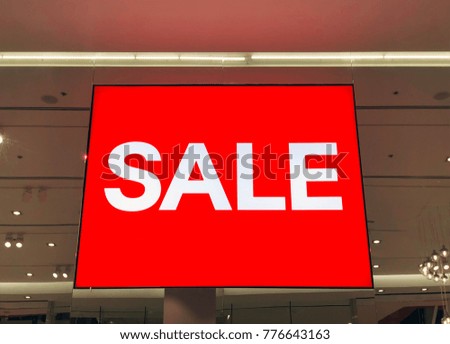 Red sign White Text Sale in Shop Display. Red Shopping billboard