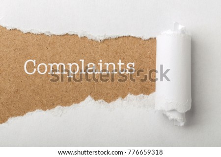 Paper tear background with word Complaints. Royalty-Free Stock Photo #776659318