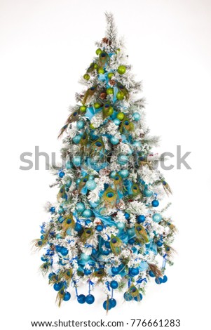 Decorated Christmas tree for the new year. Christmas tree with blue ornaments. New Year holiday. Christmas.