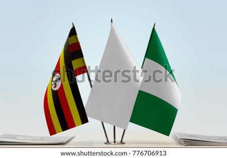 Flags of Uganda and Nigeria with a white flag in the middle
