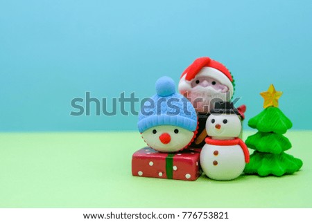 There are Christmas them, santa claus and snowman are on the snow with colorful background, they are so cute.  