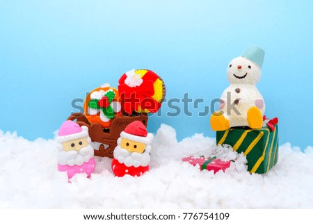 There are Christmas them, santa claus and snowman are on the snow with colorful background, they are so cute.  