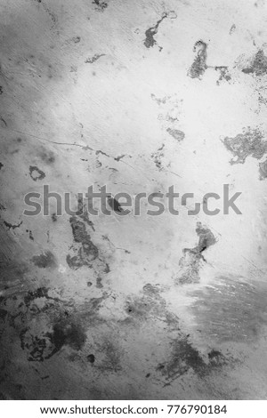 Old cracked stone wall background for design. Grunge monochrome classic texture.