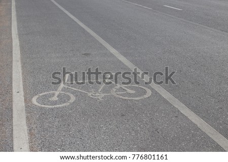 Symbol to indicate the road for bicycles.please share the road for bike.white bicycle road sign.traffic way symbol or sign on a bicycle.