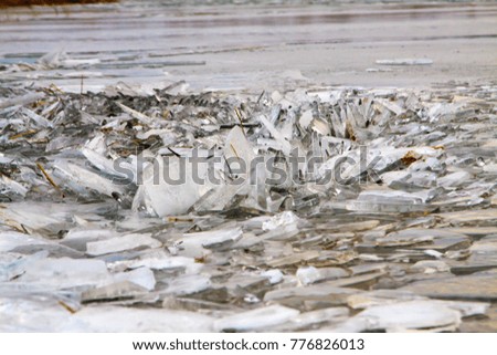 Winter landscape. Ice hummocks, frozen lake. Natural background.Kyrgyzstan.
