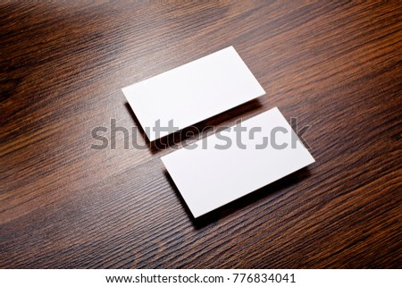 Mockup of white business cards at wooden background. Template for branding identity