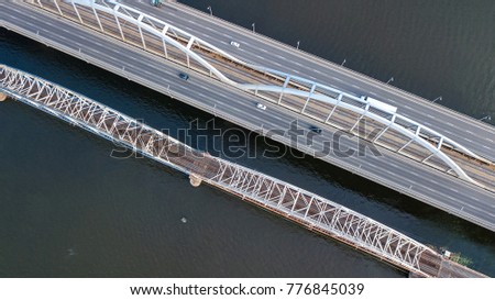 Aerial top view of bridge road automobile traffic of cars and railroad from above, transportation concept

