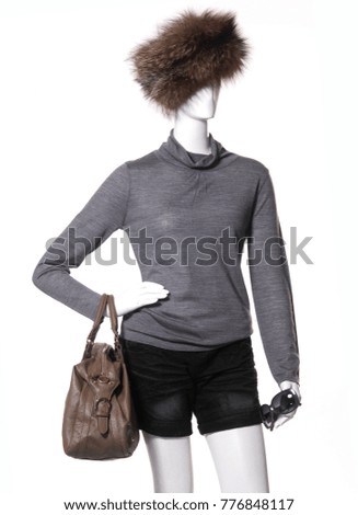 female mannequin in gray clothes with hat,,sunglasses with black shorts 