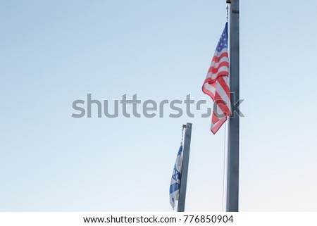 American Flag and Israel Flag on a blue sky background