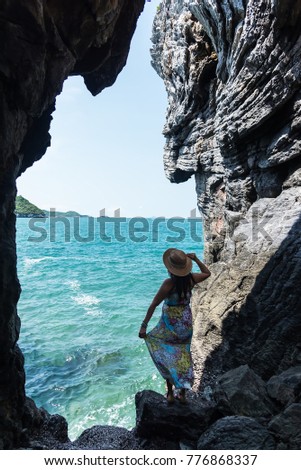 Travel women in a cave near the sea in Keo Sichang,Travel people women tourist in a cave near the sea in Keo Sichang, Thailand. Travel Concept 