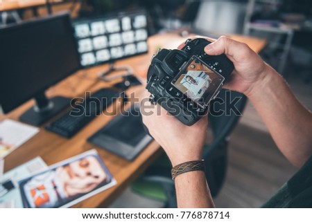Close up male arm keeping digital device with screen. Photo of cheerful man locating it. Image concept
