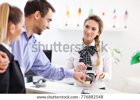 Picture of guests paying for hotel