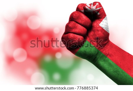 Flag of Oman painted on male fist