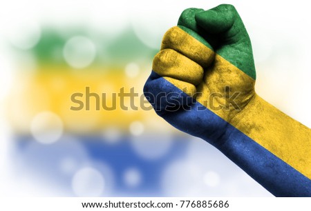 Flag of Gabon painted on male fist,strength