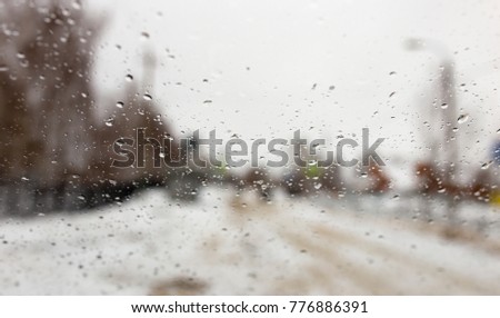 Drops on the car window in winter