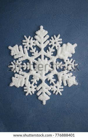 Winter decoration. White snowflake. Free space for text. Flat lay.