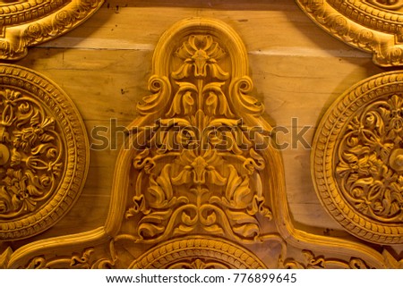 Ancient wood carved ceiling in a fort of india. Detail carved background monochrome 