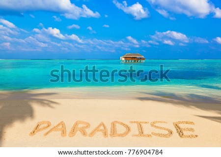 Word Paradise on beach - nature holiday background