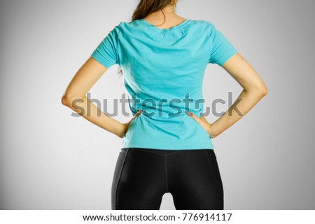 A young girl in blank blue t-shirt. Prepared for your logo.