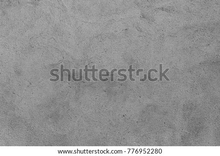 Plastered grey wall surface as a seamless background