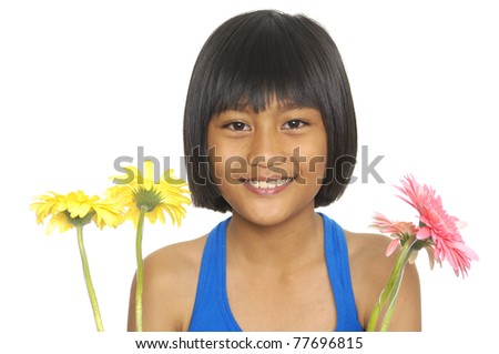 little girl smiling and holding a sunflower