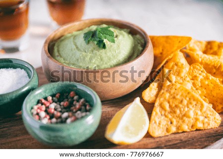 Arrangement Of Nachos (Corn Chips) And Guacamole (Avocado Sauce)