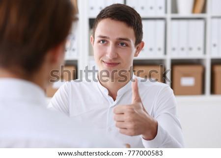 Male businessman showing ok or confirm sign with thumb up during conference closeup. High level and quality product serious offer mediation solution happy client creative adviser participation concept