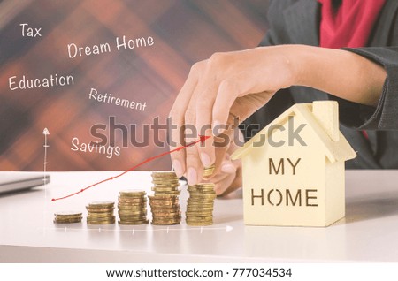 hand holding stack of coins for financial and saving money concept