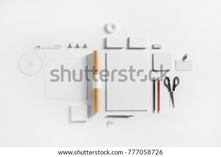 Photo of blank stationery set on white paper background. Corporate identity template. Responsive design mockup. Top view. Flat lay.