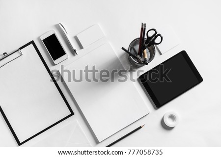 Blank stationery set on white paper background. Template for branding identity. For graphic designers presentations and portfolios. Top view.