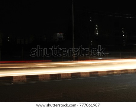 Abstract background of Long exposure vehicle light trails, night photography, noisy and blurred