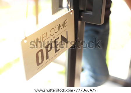 Open signs hanging with chain,