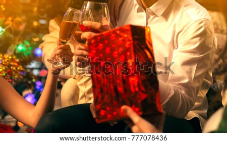 party, drinks, holidays, people and celebration concept Picture showing group of friends celebrating Christmas at home
