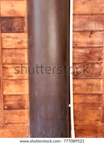Wooden texture wall  with pole in the middle decoration of Thai house