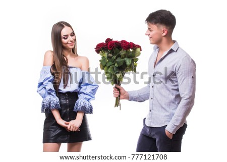 Young beautiful caucasian couple with flowers isolated on white