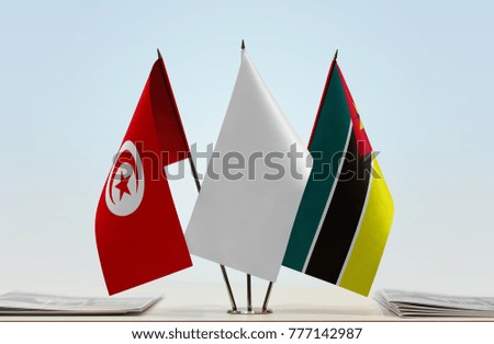 Flags of Tunisia and Mozambique with a white flag in the middle