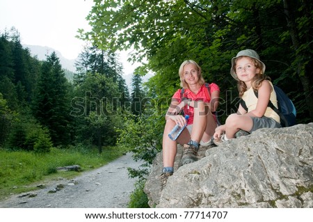 Trekkers - little girl with mother on mountain trek