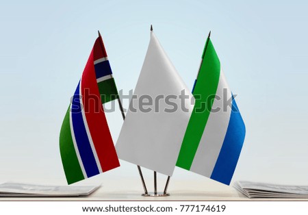 Flags of The Gambia and Sierra Leone with a white flag in the middle