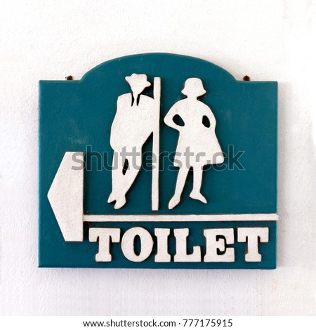 bathroom sign, public sign toilet male-female old vintage style on the wall of white cement, restroom toilet sign
