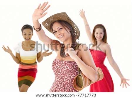 Group of happy young women waving hands in summer dresses.?