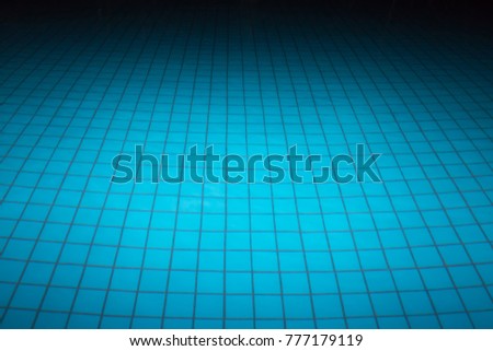 Blue tile on the bottom of the night pool