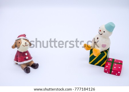 Cute snowman and a dog in red Santa  dress with two gift boxes on white isolated backgound