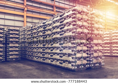 Aluminum Ingot storage in indoor warehouse for export. Vintage color. Royalty-Free Stock Photo #777188443