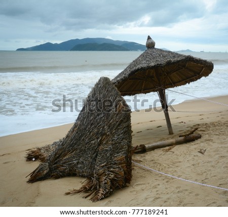 Fallen umbrellas due to storm or hurricane damage in Nha Trang, Vietnam.