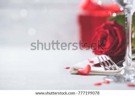 Valentine's Day or Romantic dinner concept. Valentine day or proposal background. Close up view of restaurant table with romantic table place setting. Copy space  Royalty-Free Stock Photo #777199078