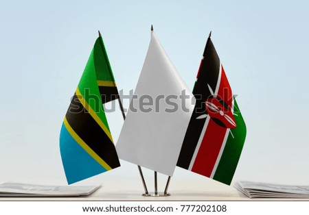 Flags of Tanzania and Kenya with a white flag in the middle