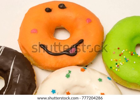 donuts with icing on a white background