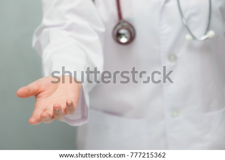 Female doctor giving her hand for helping to patient closeup.