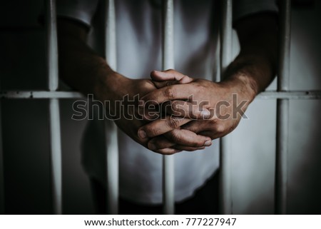 Hands of men desperate to catch the iron prison,prisoner concept,thailand people,Hope to be free. Royalty-Free Stock Photo #777227947