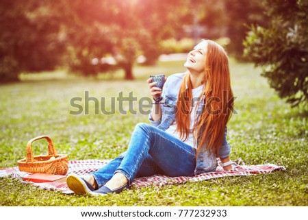 girl sitting in the sunny park. picnik